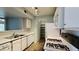 Well-lit kitchen featuring white appliances, ample counter space, and a convenient pantry at 7885 W Flamingo Rd # 2003, Las Vegas, NV 89147