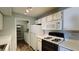 Clean kitchen equipped with white appliances, pantry, and lots of storage at 7885 W Flamingo Rd # 2003, Las Vegas, NV 89147