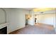 Spacious living room with neutral carpet, and a view of the kitchen and adjacent dining area at 7885 W Flamingo Rd # 2003, Las Vegas, NV 89147