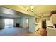 Open living space with fireplace, sliding glass doors, and seamless flow into the kitchen at 7885 W Flamingo Rd # 2003, Las Vegas, NV 89147
