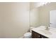 Elegant half bath features a white vanity top and an espresso-stained cabinet for added style at 8541 Highland View Ave, Las Vegas, NV 89145