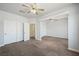 A carpeted bedroom featuring closet space and an open doorway at 8541 Highland View Ave, Las Vegas, NV 89145