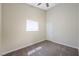 Carpeted bedroom featuring a window with blinds and a ceiling fan at 8541 Highland View Ave, Las Vegas, NV 89145