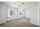Bright bedroom with multiple windows offering views and ceiling fan at 8541 Highland View Ave, Las Vegas, NV 89145