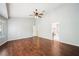 A lovely bedroom featuring wood floors, a ceiling fan, and ample natural light at 8541 Highland View Ave, Las Vegas, NV 89145