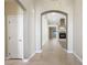 Inviting hallway featuring neutral tones, tile flooring, and archway leading to the living room at 8541 Highland View Ave, Las Vegas, NV 89145