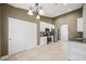 Well-lit kitchen with stainless steel appliances, granite countertops, travertine floors and ample cabinet space at 8541 Highland View Ave, Las Vegas, NV 89145