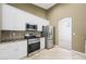 Bright kitchen featuring stainless steel appliances, a gas range, and white cabinets for modern appeal at 8541 Highland View Ave, Las Vegas, NV 89145