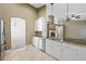 Bright kitchen with stainless appliances, granite counters, and a view to the living room at 8541 Highland View Ave, Las Vegas, NV 89145