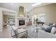 Bright living room with fireplace, neutral colors, vaulted ceiling, and skylight at 8541 Highland View Ave, Las Vegas, NV 89145