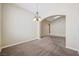 Spacious living room with carpet, chandelier and abundant natural light, great for relaxation and entertainment at 8541 Highland View Ave, Las Vegas, NV 89145