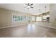 Bright and airy living room showcasing tile flooring, plantation shutters, and a ceiling fan at 8541 Highland View Ave, Las Vegas, NV 89145