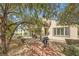 Serene backyard features a built-in grill, a paved area, and lush landscaping at , Henderson, NV 89044