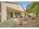 Covered patio featuring an outdoor seating area with beautiful landscaping at , Henderson, NV 89044