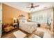 Comfortable bedroom with ceiling fan, plantation shutters, and stylish decor at , Henderson, NV 89044