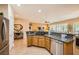 Open kitchen with granite countertops, stainless appliances, breakfast bar, and tile flooring at , Henderson, NV 89044