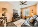 Comfortable living room features dark floors and a ceiling fan at , Henderson, NV 89044