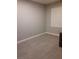 Bedroom featuring hardwood floors, neutral paint, and large window with shutters at 1006 Cove Palisades Dr, North Las Vegas, NV 89031