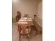 Dining room featuring a light wood table with bench, six chairs, and lots of bright light at 1006 Cove Palisades Dr, North Las Vegas, NV 89031