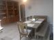 Dining room with a large table, six chairs, and a large built-in bookcase at 1006 Cove Palisades Dr, North Las Vegas, NV 89031