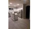 Spacious kitchen with stainless steel appliances, white cabinets, and center island at 1006 Cove Palisades Dr, North Las Vegas, NV 89031