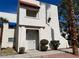 Charming two-story condo with stucco exterior and red tile accent over entrance at 101 Luna Way # 145, Las Vegas, NV 89145