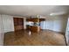 Spacious open-concept living area with tile flooring that flows into the kitchen area at 101 Luna Way # 145, Las Vegas, NV 89145