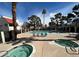 Inviting community pool and spa area with lounge chairs and mature landscaping, perfect for relaxation at 101 Luna Way # 145, Las Vegas, NV 89145