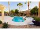 Beautiful backyard pool and spa with a built-in swim-up bar and mature palm trees at 10243 Cowboys Dream St, Las Vegas, NV 89131