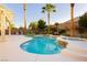 Inviting backyard with a kidney-shaped pool, in-ground spa, fire pit, and mature landscaping at 10243 Cowboys Dream St, Las Vegas, NV 89131