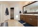 The bathroom offers a double vanity, walk-in closet, and ceramic tile floors at 10243 Cowboys Dream St, Las Vegas, NV 89131
