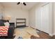 Bedroom with ceiling fan, window blinds, and wooden floors at 10243 Cowboys Dream St, Las Vegas, NV 89131