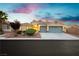 Charming single-story home with a well-maintained lawn, desert landscaping, and a spacious two-car garage at 10243 Cowboys Dream St, Las Vegas, NV 89131