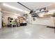 A spacious garage with epoxy floors, overhead storage racks, and plenty of open space at 10243 Cowboys Dream St, Las Vegas, NV 89131