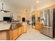 Modern kitchen featuring stainless steel appliances, granite countertops, and custom cabinetry for a sleek design at 10243 Cowboys Dream St, Las Vegas, NV 89131