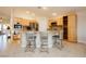 Charming kitchen with granite countertops, stainless steel appliances, and an island with barstool seating at 10243 Cowboys Dream St, Las Vegas, NV 89131
