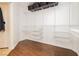 This large walk-in closet boasts wooden floors and custom storage at 10243 Cowboys Dream St, Las Vegas, NV 89131