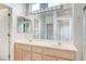 Bathroom featuring dual sinks, large mirrors, and recessed lighting at 10636 Argents Hill Dr, Las Vegas, NV 89134