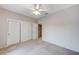 Neutral bedroom featuring carpet, ceiling fan, and closet with shelving system at 10636 Argents Hill Dr, Las Vegas, NV 89134