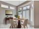 Bright dining area with round table set and bay window providing natural light at 10636 Argents Hill Dr, Las Vegas, NV 89134