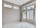Bright dining room nook area with tile floor and large windows with views of the back yard at 10636 Argents Hill Dr, Las Vegas, NV 89134