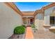 Front entryway features a tiled walkway, desert landscaping, and a covered porch at 10636 Argents Hill Dr, Las Vegas, NV 89134