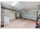 Garage featuring built-in cabinets and an automatic garage door at 10636 Argents Hill Dr, Las Vegas, NV 89134