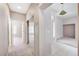 Hallway that has a mirror accent and natural lighting at 10636 Argents Hill Dr, Las Vegas, NV 89134