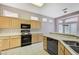 Bright kitchen with modern appliances, countertops, and tile flooring beneath natural lighting at 10636 Argents Hill Dr, Las Vegas, NV 89134