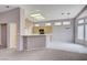 Bright eat-in kitchen offers bar seating and an abundance of natural light at 10636 Argents Hill Dr, Las Vegas, NV 89134