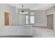 Open-concept living room with neutral paint, bright windows, and carpeted floors at 10636 Argents Hill Dr, Las Vegas, NV 89134