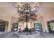 Bright lobby showcasing a beautiful metal tree art piece and high ceilings with natural light at 10636 Argents Hill Dr, Las Vegas, NV 89134