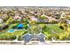 Aerial view featuring the community park, playground, and lush landscaping in a residential neighborhood at 10668 Porta Romana Ct, Las Vegas, NV 89141