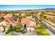 Beautiful home with manicured lawn and a three-car garage in a leafy neighborhood with mountain views at 10668 Porta Romana Ct, Las Vegas, NV 89141